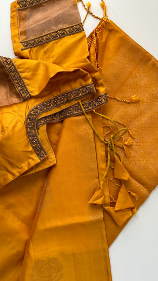 Yellow soft silk saree  zari and hand embroidered blouse with Tissue sleeves